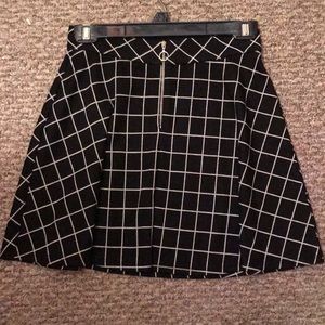 Black/white checked or plaid mini skirt